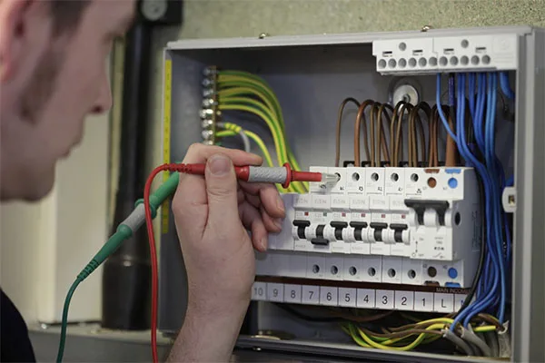 Electrician testing a residential consumer unit