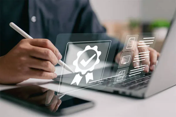 Compliance certification being reviewed on a laptop